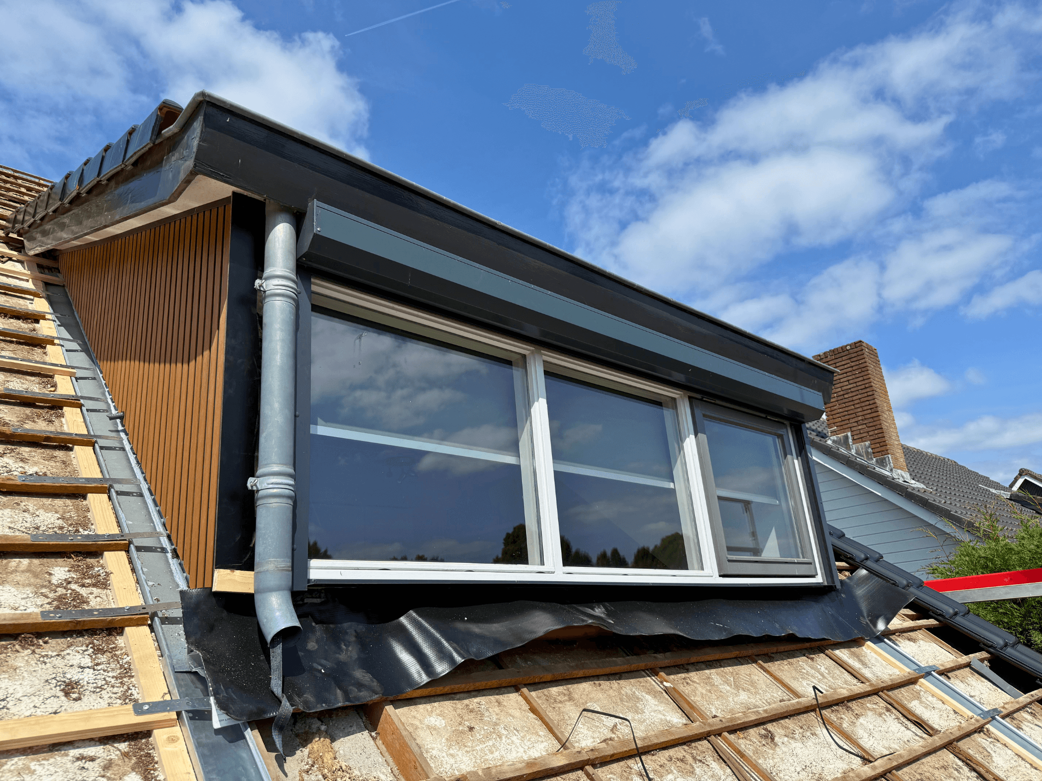 Dakkapel met gevelbekleding in Oss